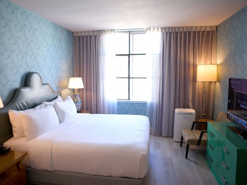 Unwind in a bright, airy room with plush king bed.