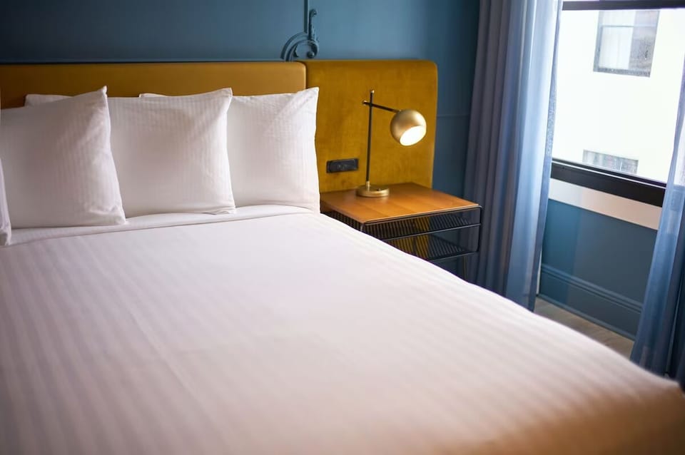 Relax into a quiet corner with pillows piled high for comfort.