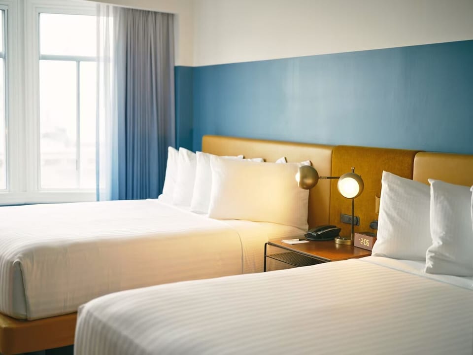 Settle in with two plush beds and sunlit, airy comfort.