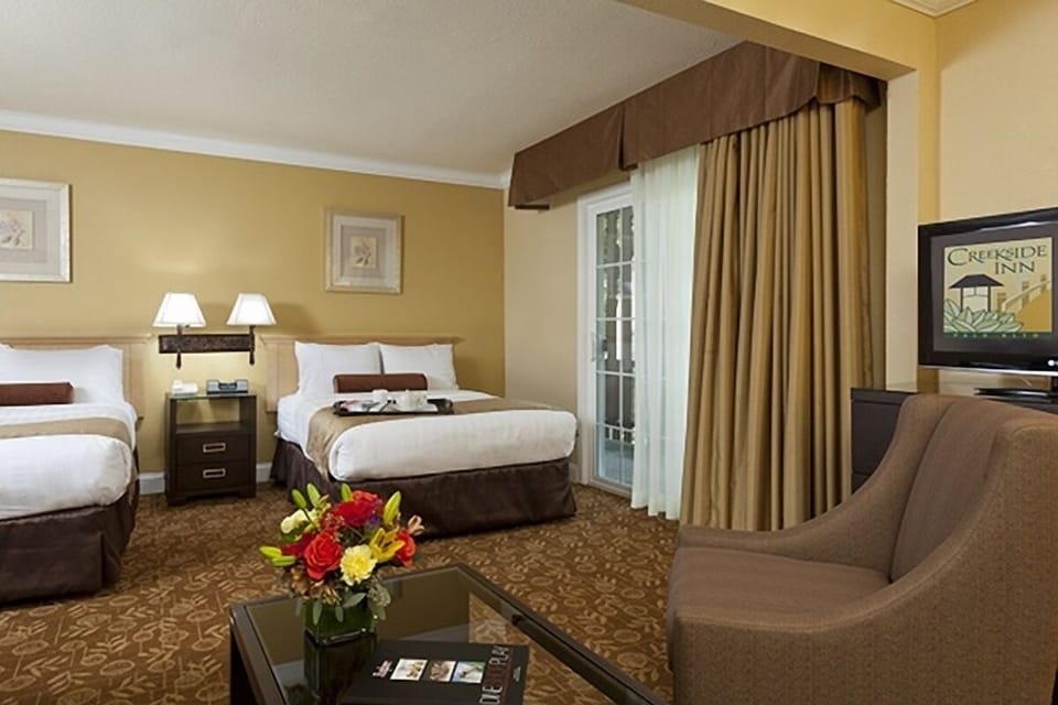 Settle in with two comfy beds and a cozy lounge corner.