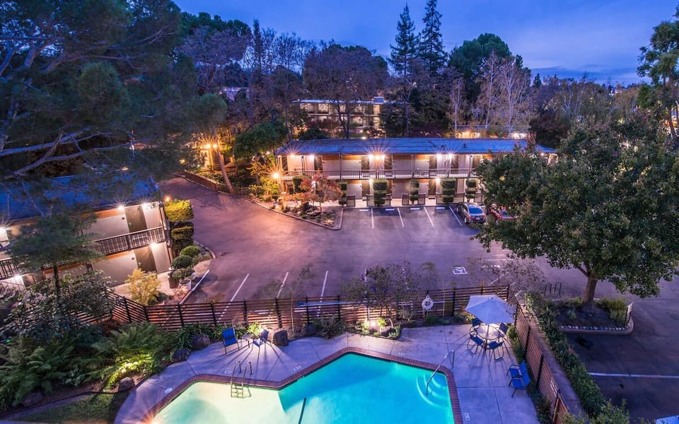 Arrive to glowing evening ambiance with a stunning pool centerpiece.