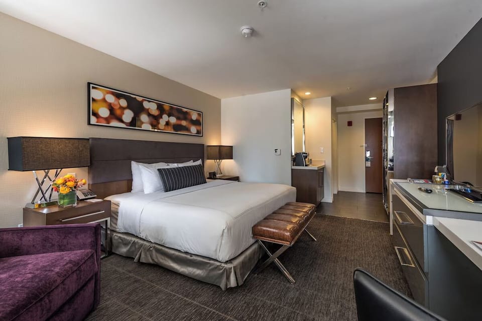 Arrive and relax in a sleek room designed for comfort.