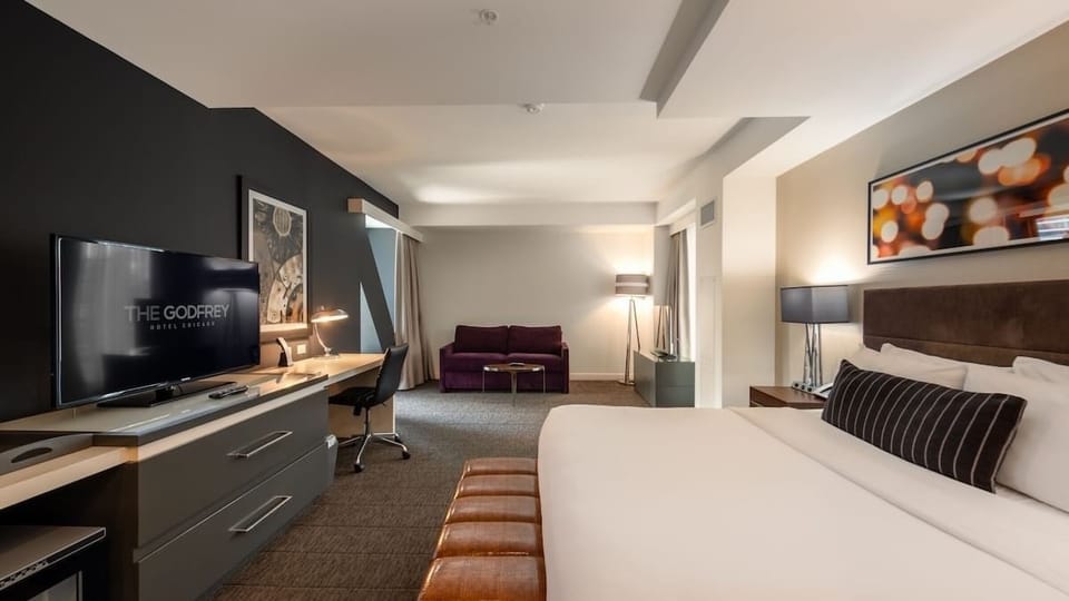 Lounge comfortably with a sofa area just steps from bed.