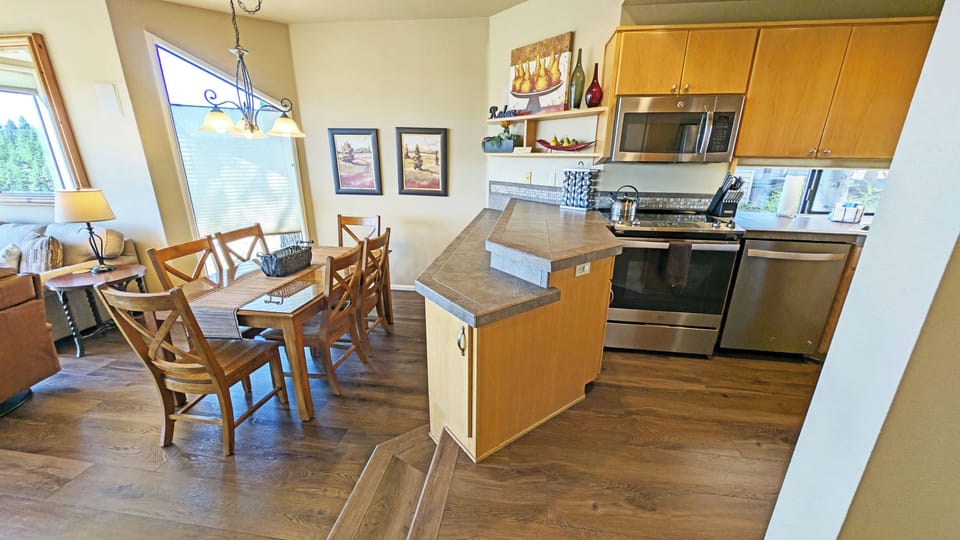 To the right, Kitchen, Dining, Living