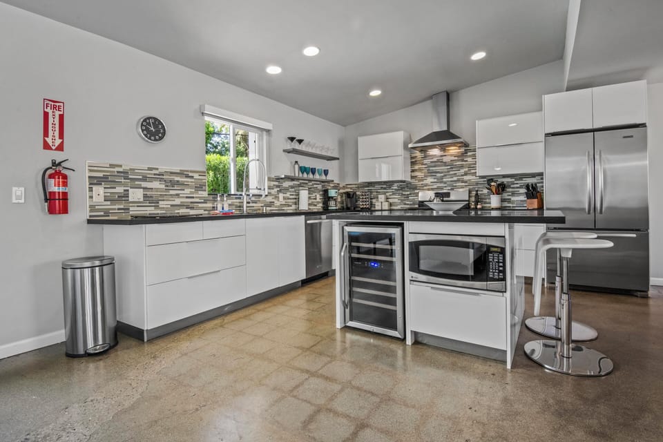 Modern chef's kitchen with stainless appliances and custom cabinetry