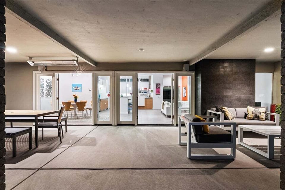 Covered outdoor lounge seamlessly connected to the indoor living space