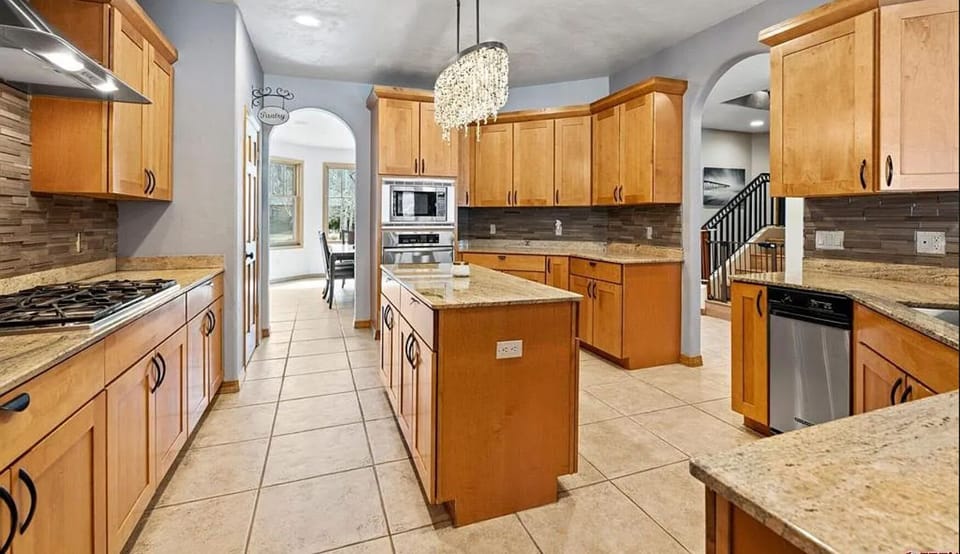 Spacious chef's kitchen with open concept and many amenities.