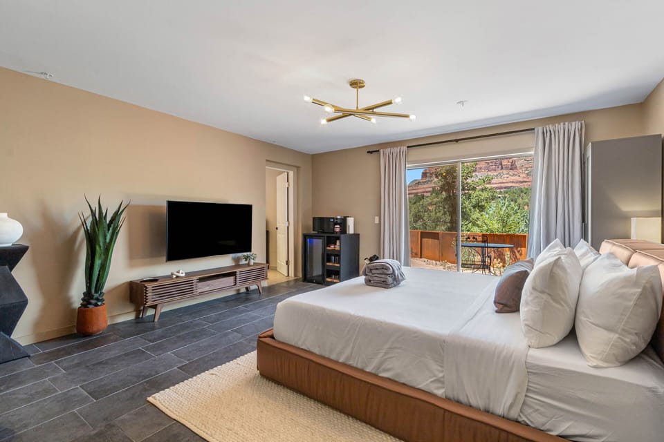 King bed room, Patio with awe-inspiring views of Steamboat Rock and Wilson Mountain, patio access.