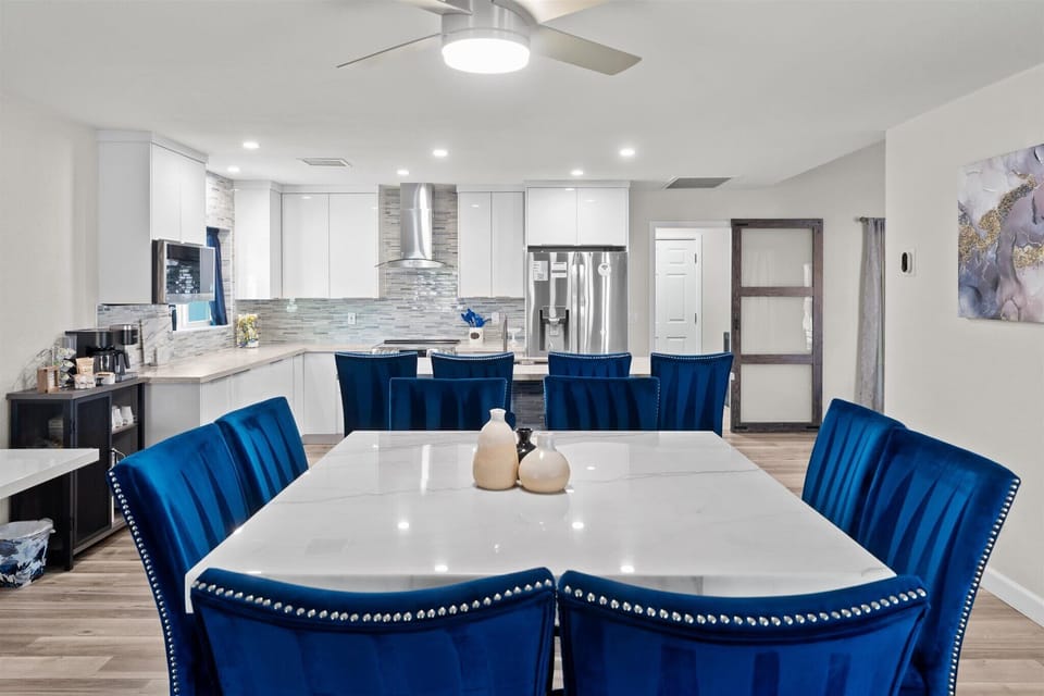 Enjoy the flow of our open floor plan with a sleek modern kitchen and dining area made for gathering.

