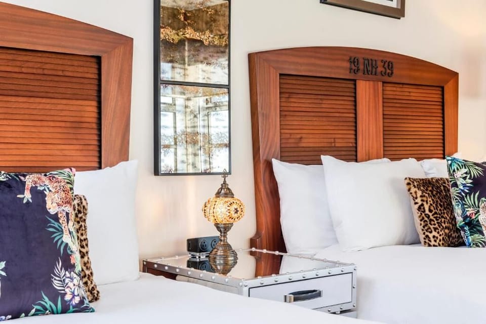 Sink into plush pillows and feel the room’s cozy charm.