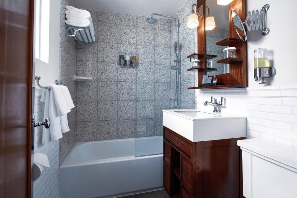 Soak and reset with fluffy towels and a spotless vanity.