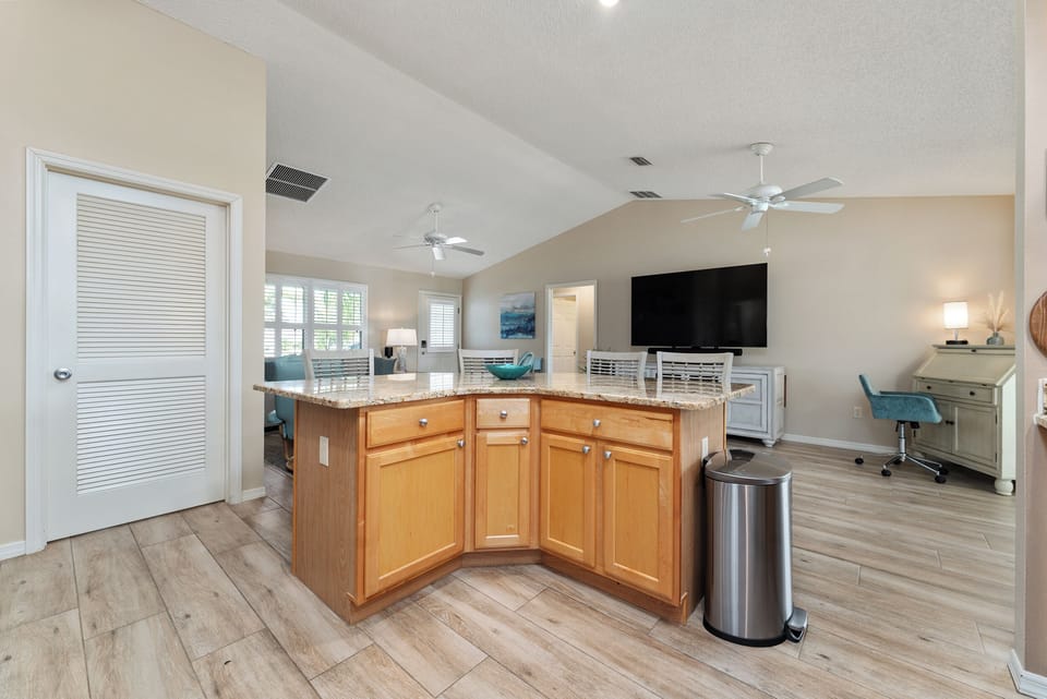 Kitchen Island with Plenty of Prepping Space. To the Left  is the Laundry Room