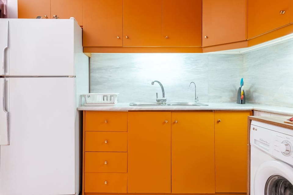 Bright and cheerful kitchen with retro charm, ready for your culinary adventures.