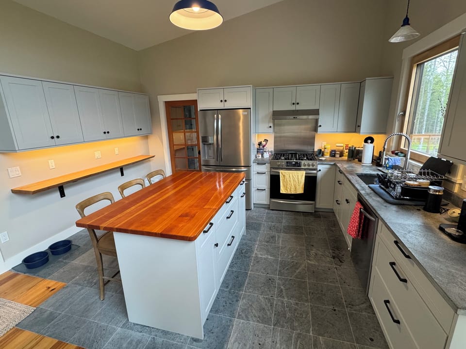 The kitchen is designed in a true VT fashion with soapstone flooring and counter