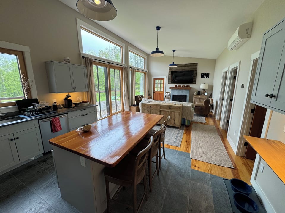 Open floor plan with living room and fully stocked kitchen.