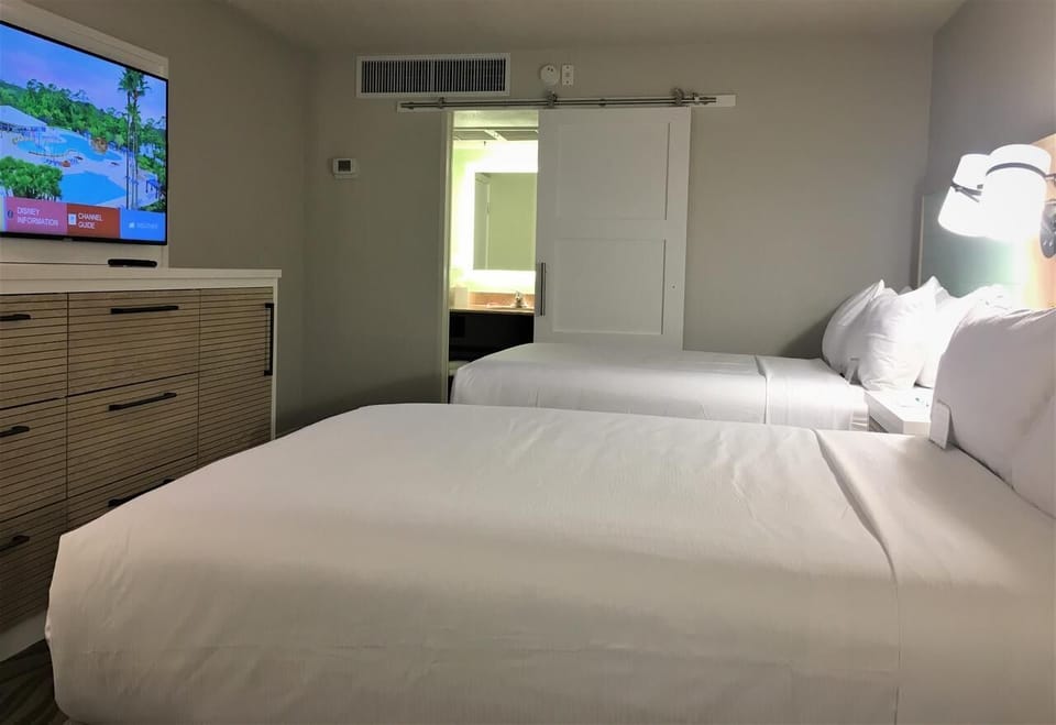 Kick back with in-room TV and two comfy beds.