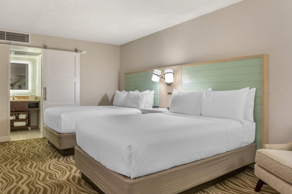 Settle into crisp linens with easy ensuite access nearby.