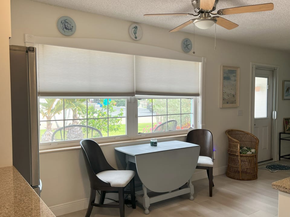 Kitchen table opens into a 6 ft dining table - additional chairs in the garage