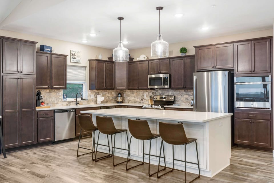 The open, airy kitchen offers ample space & every home comfort