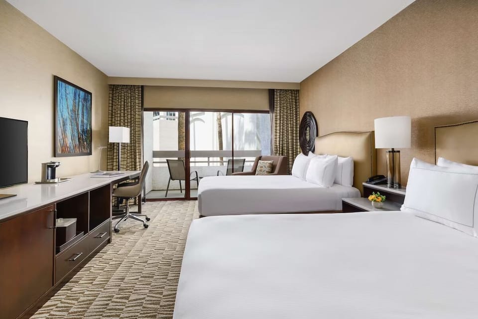 Drift off comfortably in a bright room with seating nook.
