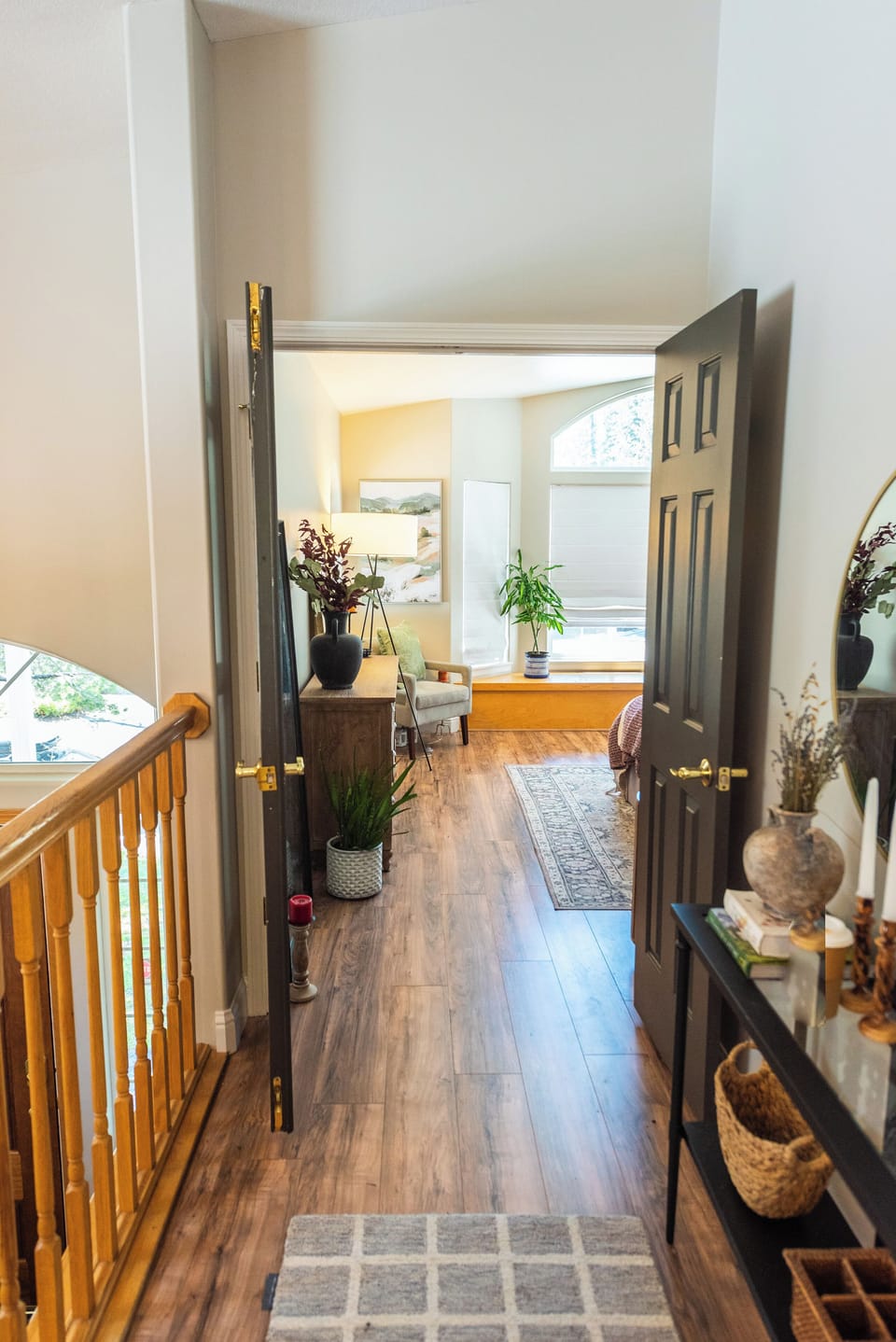 Hallway to master bedroom with french doors