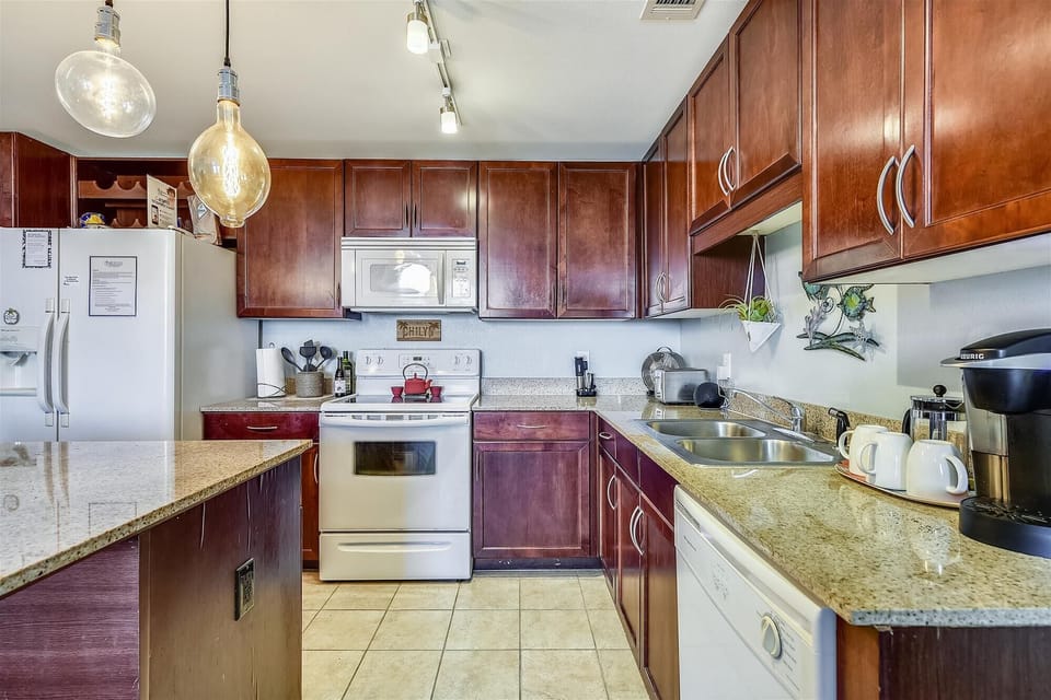 Large spacious kitchen with island seating, Keurig and full stocked to cook all your meals in the unit if you want!