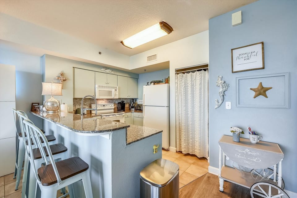 Kitchen area with bar seating