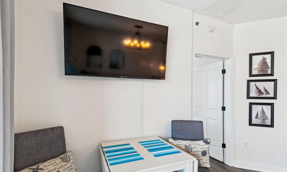 Dining table for 4 (2 stools underneath)
TV