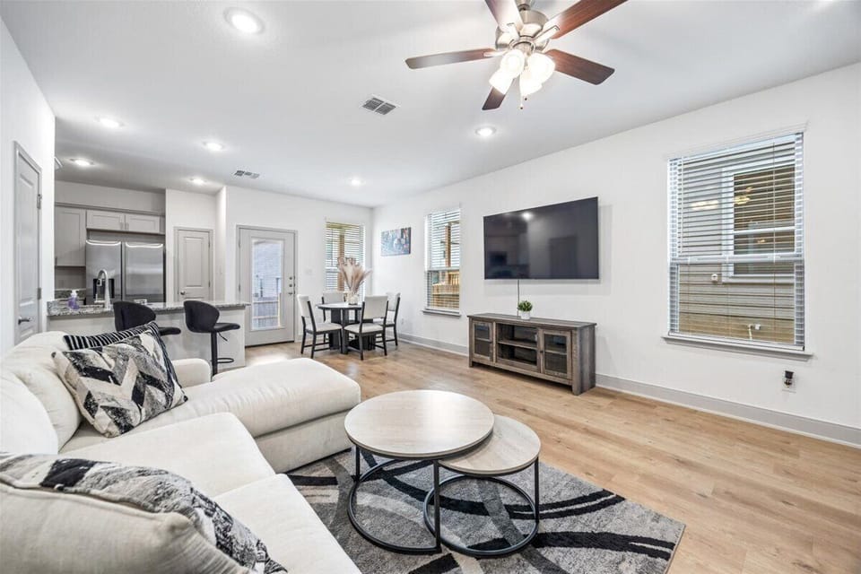 Designed for relaxation, this large living room offers calming natural light.