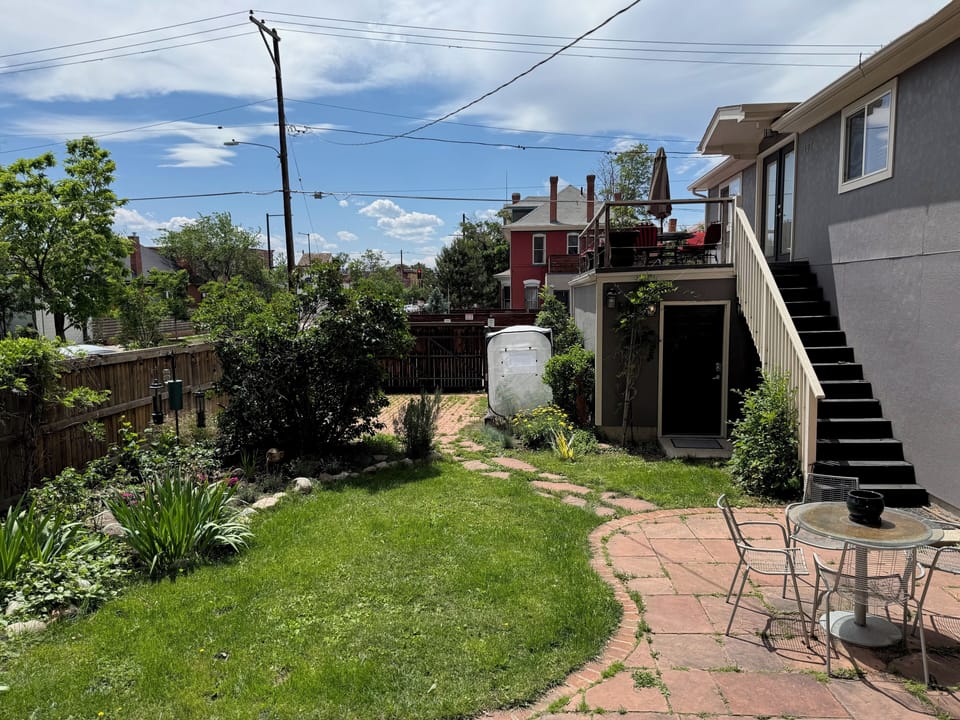 Stairs to the unit, deck, and private parking space