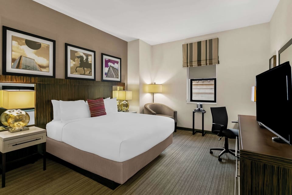Relax in a spacious, modern room with soothing warm lighting.