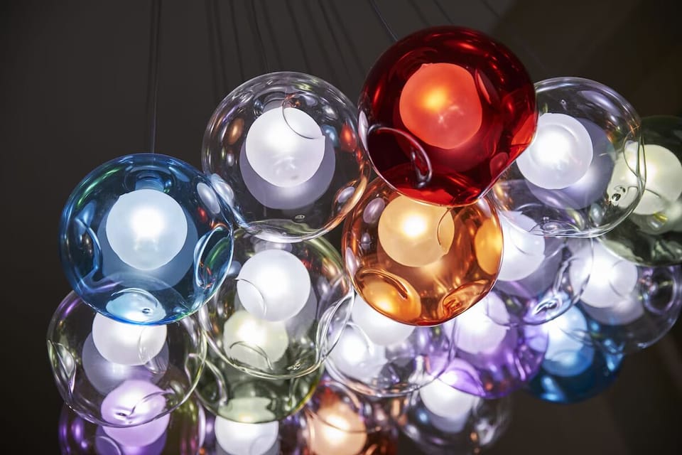 Feel the boutique vibe under artful lighting and glossy finishes.