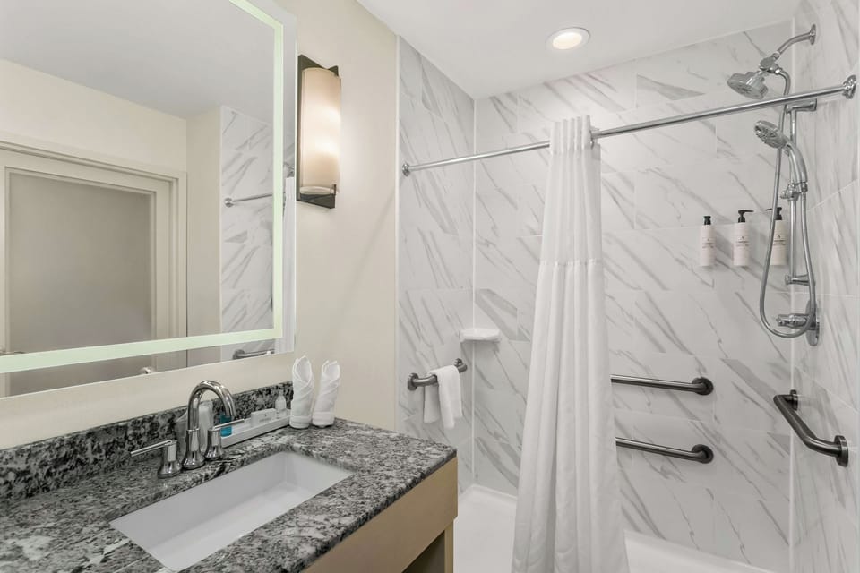 Rinse off in a spotless, spa-like shower with easy-access rails.