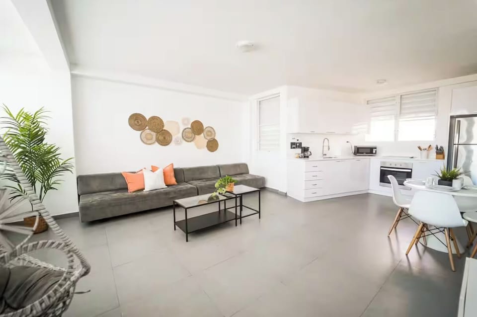 The living room, dining area and kitchen 