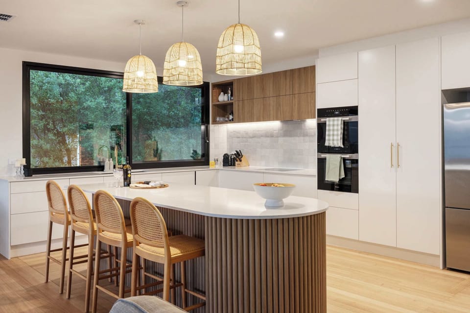 Kitchen area and kitchen bench.