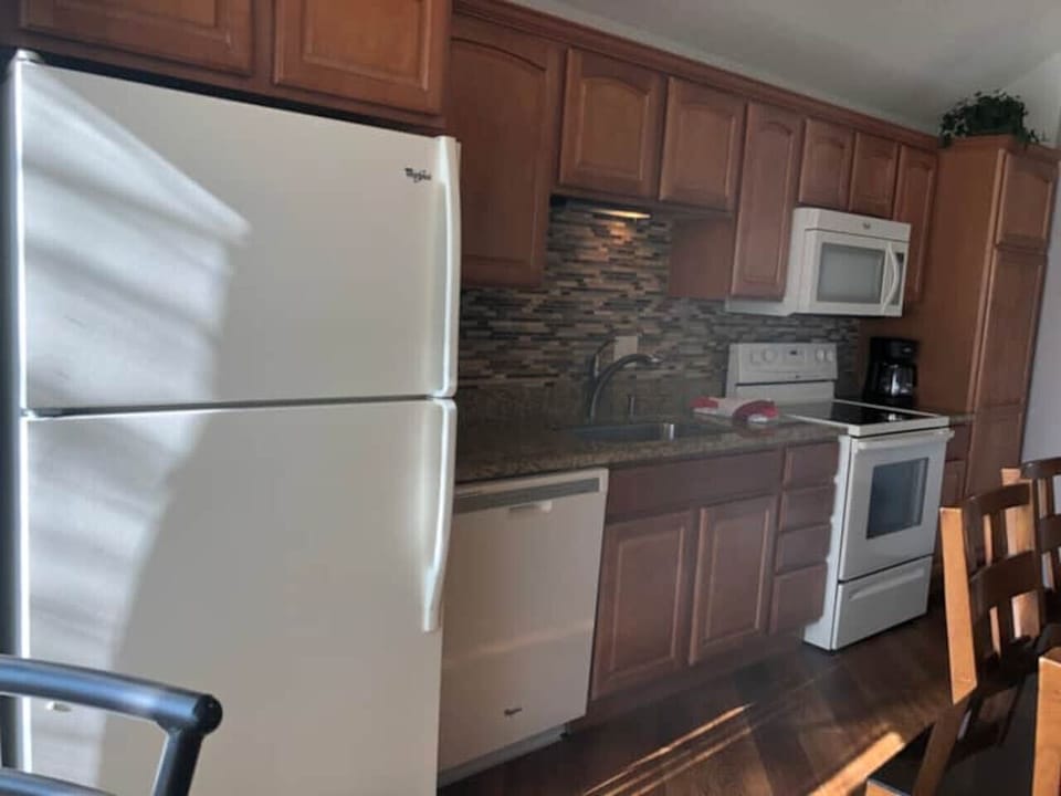 Whip up delicious meals in our well-equipped kitchen, featuring ample counter space and all the essentials for your stay.