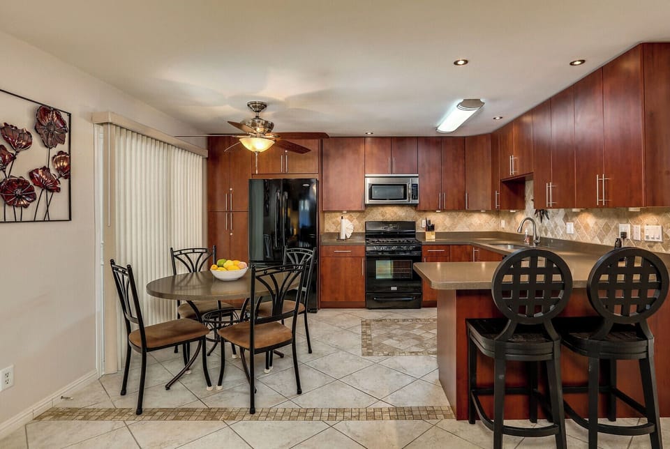 Dining area and upgraded kitchen with modern finishes