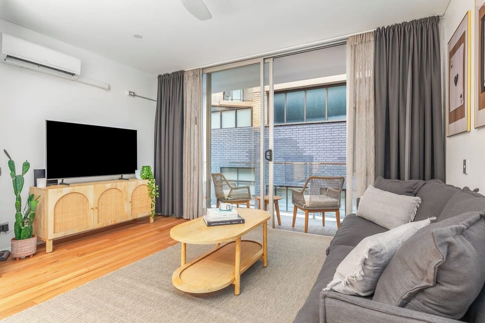 In the living area, settle in for a cosy night with your favourite shows on the TV, and enjoy year-round comfort thanks to split-system air conditioning and heating, perfect for relaxing after a day in the city.