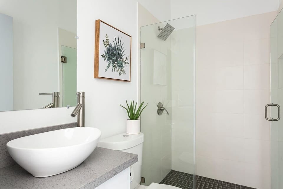 Modern bathroom with bathtub and sleek finishes.