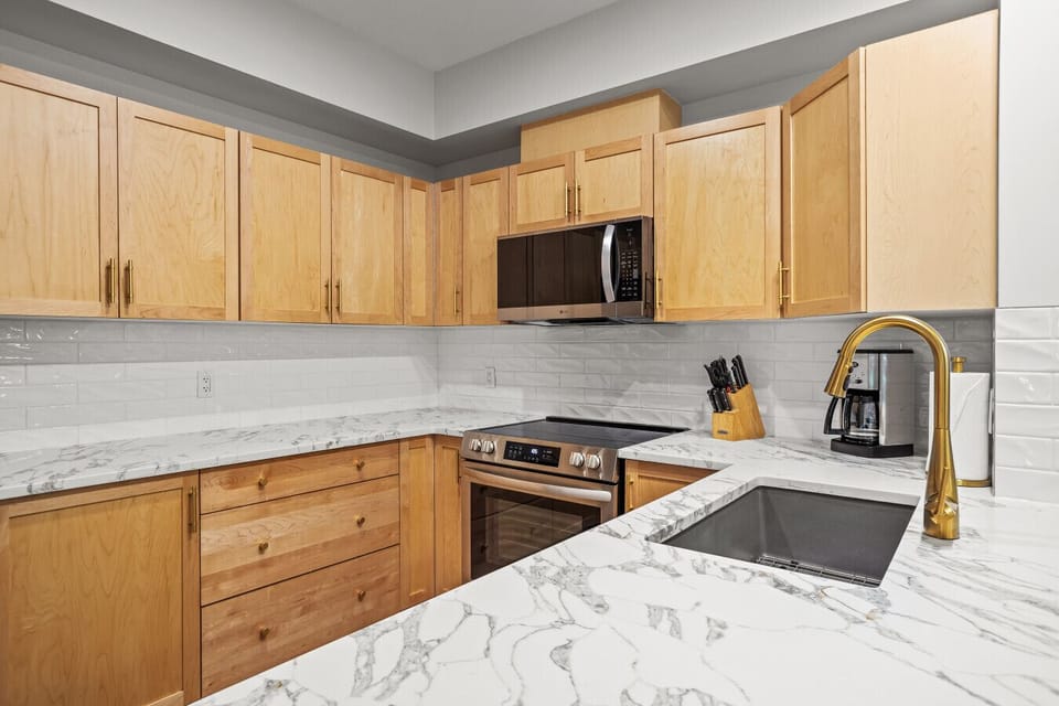 Upgraded kitchen, full stocked for ensuite hosting. Arabascata quartz counter tops and all brand new appliances .