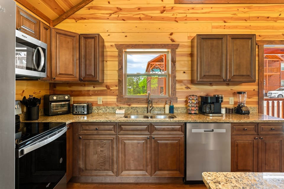 Kitchen with stainless steel appliances and all the essentials for home cooked meals.