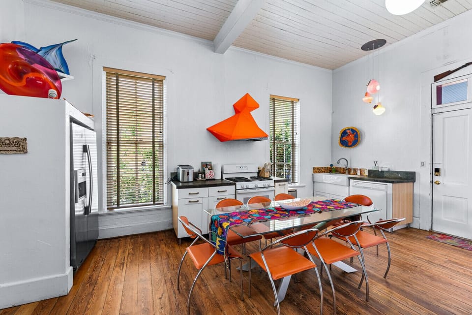 Eclectic kitchen with bold accents and seating for eight.