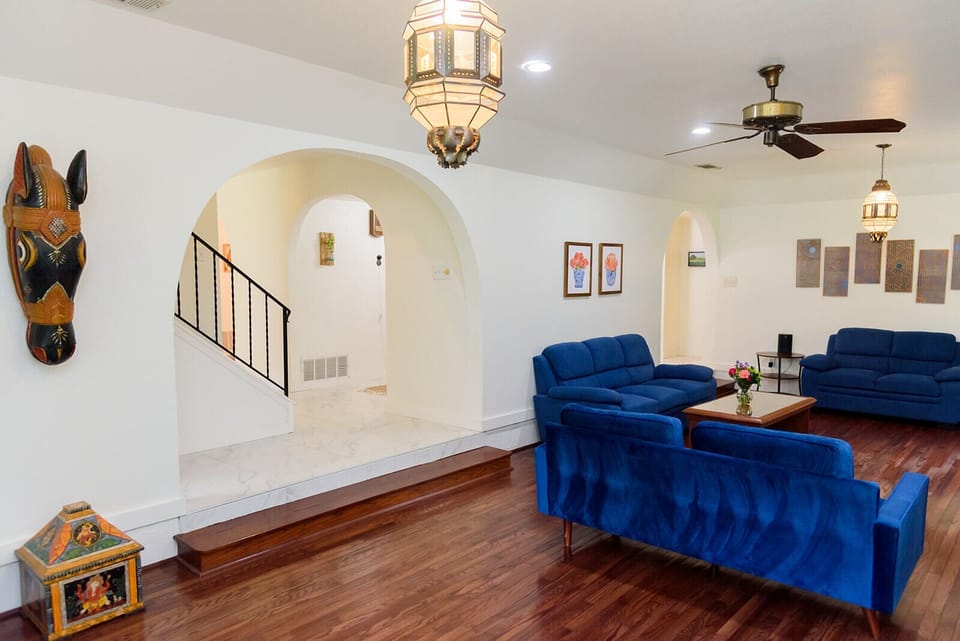 Open and inviting living room featuring a cozy seating and a large window.