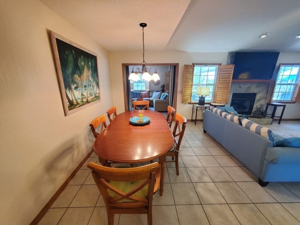 Open-plan dining area leads to a cozy living room, perfect for family gatherings.