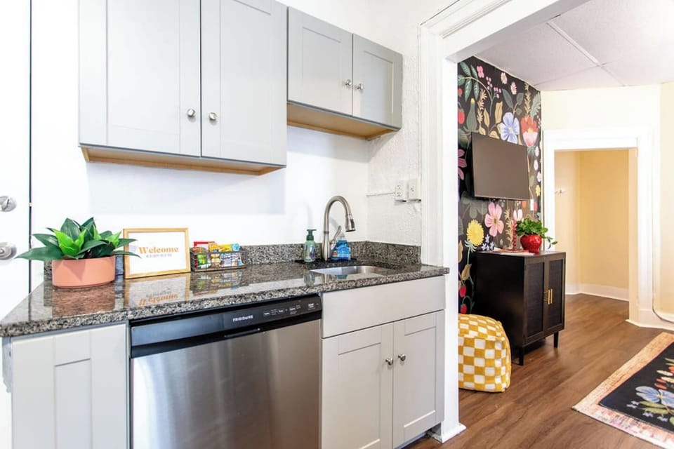 Full kitchen featuring sleek, modern stainless steel appliances for a stylish and functional cooking space.
