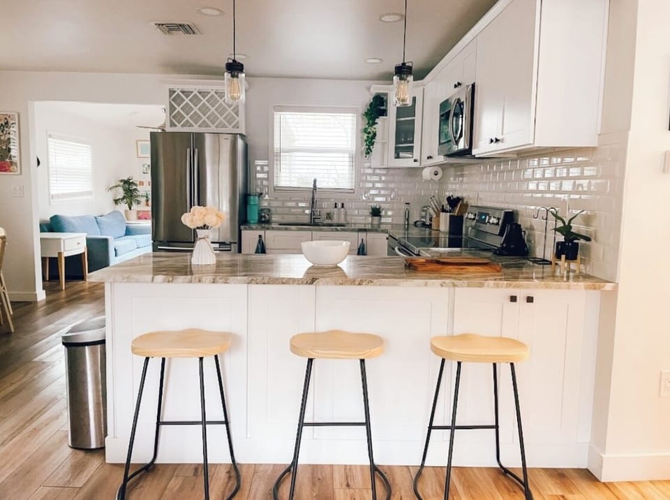 Fully stocked gourmet kitchen with counter seating