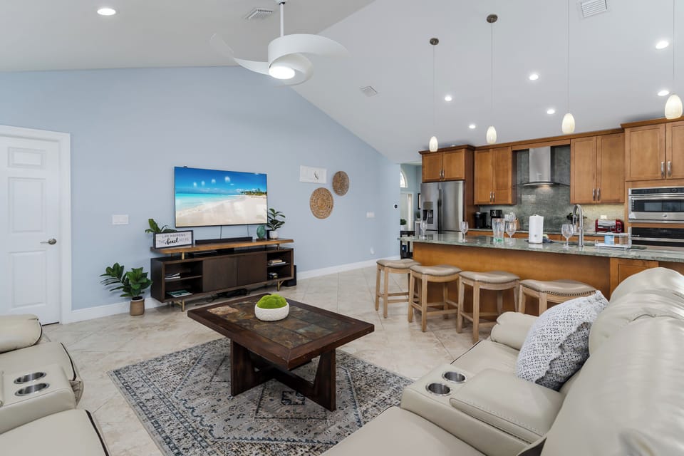 Your open-concept living space flows seamlessly from cozy seating to a fully equipped kitchen, perfect for entertaining and relaxing together.