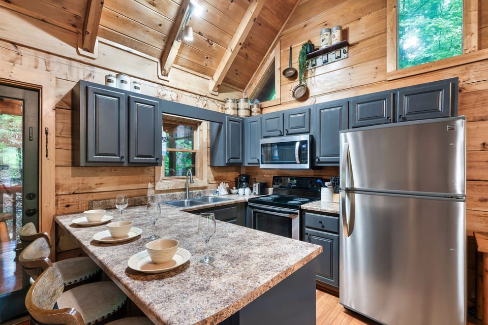 Warm, rustic, and fully equipped. Whip up your family favorites in the kitchen.