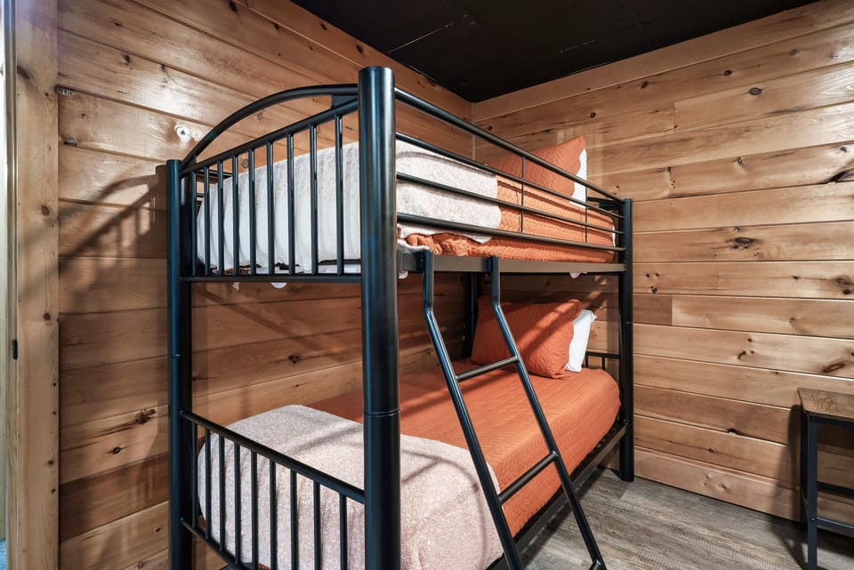 Little adventurers love this cozy bunk room setup, perfect for sleepovers.
