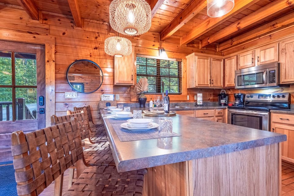 Spacious Kitchen | Large Island with Seating | Modern Lighting | Perfect for Family Meals |